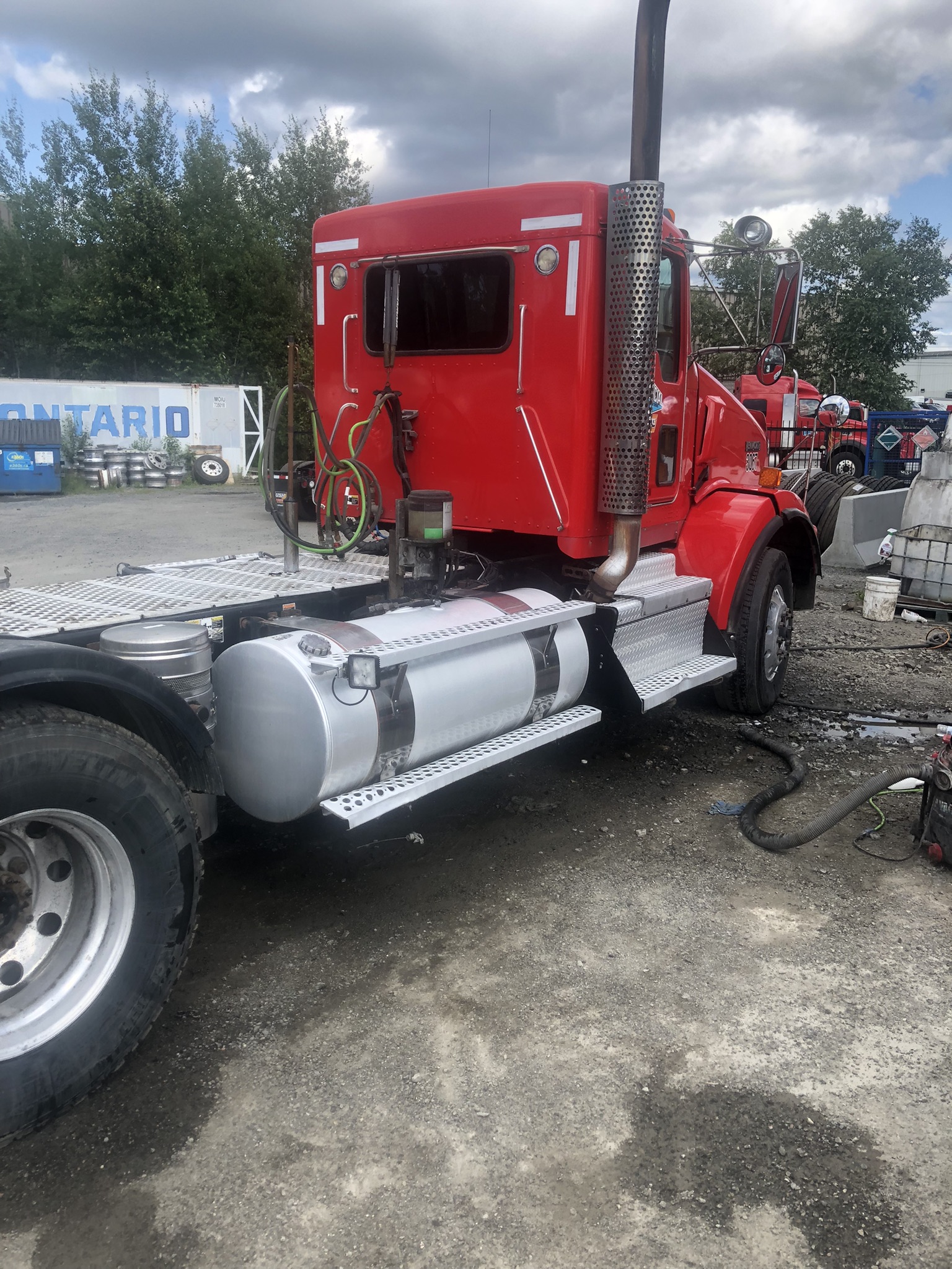 Avlis Clean washing a truck with polished tanks and steps